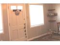 Bright entryway with a window, neutral walls, and a view into the home at 5409 E 19Th St, Indianapolis, IN 46218