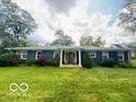 Charming single story house with inviting front entry and lush green lawn at 6546 Derbyshire Rd, Indianapolis, IN 46227