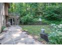 Spacious concrete patio in the backyard with an entrance to the house at 7303 W Division Rd, Bargersville, IN 46106