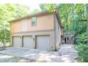 View of the three car garage and back of a two story home at 7303 W Division Rd, Bargersville, IN 46106