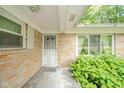 Close up of the front entrance and garden near the porch at 10104 Sycamore Ln, Indianapolis, IN 46239