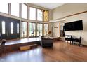 Spacious living room featuring tall windows and wood floors at 13151 W Youth Camp Rd, Columbus, IN 47201