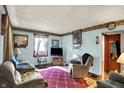 Spacious living room with carpet, comfortable seating and natural light at 2029 N Colorado Ave, Indianapolis, IN 46218