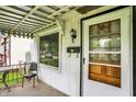 Close up of a front porch featuring outdoor seating and charming details at 2029 N Colorado Ave, Indianapolis, IN 46218