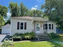A quaint single-story home with a detached garage and a neatly kept lawn at 249 Ohio St, Franklin, IN 46131