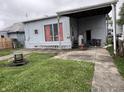 This property features a backyard with a covered area, offering a space for outdoor gatherings and relaxation at 2731 Delaware St, Anderson, IN 46016