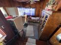 A bedroom that features carpet, wood walls and vintage furnishings at 2731 Delaware St, Anderson, IN 46016