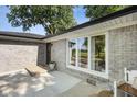 Covered entryway featuring brick siding, large windows, and a bench at 3777 W State Road 234, McCordsville, IN 46055