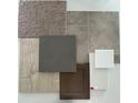 Close up showing various material samples for the interior finishes, including countertop and carpet at 430 Louisiana Dr, Pittsboro, IN 46167