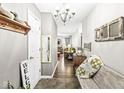 Inviting entryway with decorative accents, tile flooring, and stylish chandelier at 5865 Pennekamp Dr, Plainfield, IN 46168