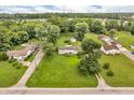 Expansive aerial view of the property showcasing lush greenery and neighborhood at 6349 S Harding St, Indianapolis, IN 46217