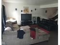 Living room with sectional couch, speakers, and tv at 8256 Meadowlark Dr, Indianapolis, IN 46226