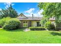 Spacious backyard with a lush green lawn and mature trees, providing a private outdoor space at 9578 Cadbury Cir, Indianapolis, IN 46260