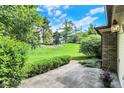 Stone patio with a view of a grassy hill, perfect for enjoying the outdoors at 9578 Cadbury Cir, Indianapolis, IN 46260