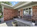 Inviting covered porch with a swing and beautiful brick accents at 1011 Stevedon Ct, Plainfield, IN 46168