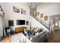 Spacious living room with high ceilings, modern decor, and lots of natural light at 19796 Chatham Shore Ln, Westfield, IN 46074