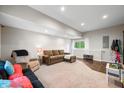 Finished basement with cozy seating, neutral walls, and ample space for entertaining or relaxing at 6300 Grouse Dr, Nineveh, IN 46164