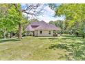 A spacious backyard shows a partial view of home with gazebo at 940 S County Road 200 W, Danville, IN 46122