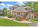 Back of house has steps leading to upper level. Pool in backyard at 940 S County Road 200 W, Danville, IN 46122