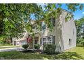 Charming two-story home featuring a well-maintained lawn, an American Flag and a two-car garage at 14373 Orange Blossom Trl, Fishers, IN 46038