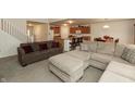 Cozy living area with comfortable couches, seamlessly blending into the kitchen and dining spaces for modern living at 2458 Bristol Dr, Franklin, IN 46131