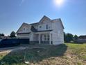 Charming two-story home with a front-entry two-car garage, bright and inviting at 3110 Montgomery Blvd, Lapel, IN 46051