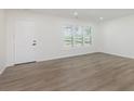 Bright living room with new floors and large windows at 3120 S Meridian Rd, Greenfield, IN 46140