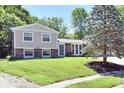 Attractive two-story home with a brick facade, well-kept lawn, and established landscaping at 524 Concord Ct, Fishers, IN 46038
