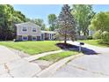 Beautiful two-story home with a lush green lawn and mature trees in a quiet neighborhood at 524 Concord Ct, Fishers, IN 46038