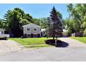 Inviting two-story home with a well-maintained lawn and mature trees in a peaceful setting at 524 Concord Ct, Fishers, IN 46038