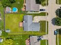 Aerial view of a home with a backyard deck and a well-maintained lawn in a suburban neighborhood at 7384 Southern Lakes Dr, Indianapolis, IN 46237