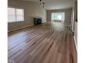 Bright living room features sleek flooring, a cozy fireplace, and a bay window for natural light at 8092 Crystal Ct, Avon, IN 46123