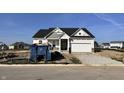 New home with a two-car garage situated on a residential street in a suburban neighborhood at 9417 Crimson Cir, Lapel, IN 46051