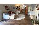 Cozy living room showcasing a comfortable sofa, stylish rug, and open floor plan at 11503 Winding Wood Dr, Indianapolis, IN 46235