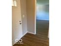 Bright foyer with hardwood floors and a view of the living area at 7313 Shanna Cir, Indianapolis, IN 46236