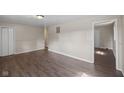 Spacious living room with wood-look flooring and neutral walls for easy personalization at 7424 North Dr, Lawrence, IN 46226