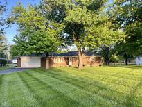 Charming brick home with manicured front lawn and mature trees at 2892 S State Road 267, Plainfield, IN 46168
