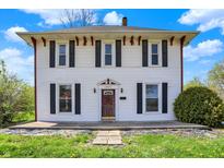 Charming two-story home with black shutters and a well-manicured lawn at 1901 N Tillotson Ave, Muncie, IN 47304