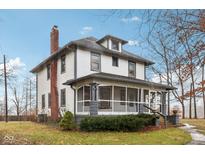 Two-story house with front porch and landscaped yard at 1185 N 10Th St, Noblesville, IN 46060