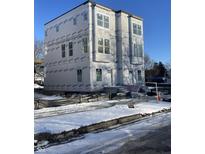 New construction home with modern design, three stories, and covered front porch at 249 N Temple Ave, Indianapolis, IN 46201