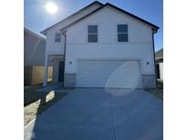 Beautiful two-story home with a white facade, an attached garage, and a well-manicured front yard at 1440 Elm St, Martinsville, IN 46151