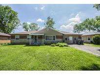 Charming single-story home featuring a well-maintained lawn and inviting curb appeal at 2925 Highwoods Dr, Indianapolis, IN 46222
