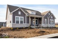 Gray two-story house with white accents and stone facade at 11362 Selsey Rd, Fishers, IN 46040