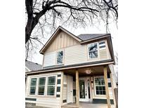 Charming two-story home with a covered front porch and decorative columns at 2626 E North St, Indianapolis, IN 46201