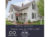 Charming home featuring a cozy front porch, vintage architectural details, and a well-maintained lawn at 47 Meadow Dr, New Palestine, IN 46163