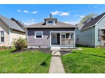 Charming bungalow-style home with a welcoming front porch and well-maintained lawn at 2137 Ringgold Ave, Indianapolis, IN 46203