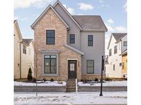 Two-story brick home with gray accents and a landscaped yard at 1659 Midland Main St, Westfield, IN 46074