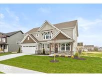 Charming two-story home with manicured lawn and attached two car garage at 1099 Gatewick Ct, Greenwood, IN 46143