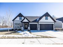 Two-story house with a gray and white exterior, two car garage, and landscaping at 18862 Shefler Blvd, Noblesville, IN 46062