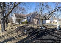 Charming single Gathering home featuring a cozy front porch and well-maintained lawn and landscaping at 1402 Auburn Dr, Brownsburg, IN 46112